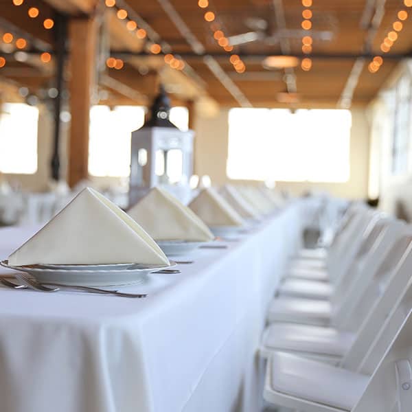 Formal dining table and chair setup for event rentals