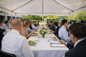 Tent dining setup with long table arrangement